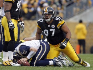 Cameron Heyward #97 of the Pittsburgh Steelers gets up after sacking  Kellen Clemens