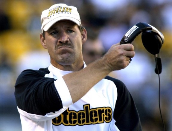 Pittsburgh Steelers coach Bill Cowher removes headset