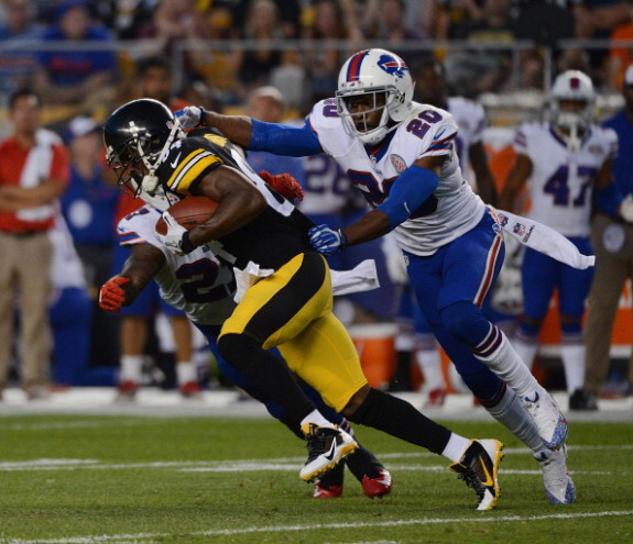 Cornerback Corey Graham #20 and safety Duke Williams #27 of the Buffalo Bills tackle wide receiver Antonio Brown