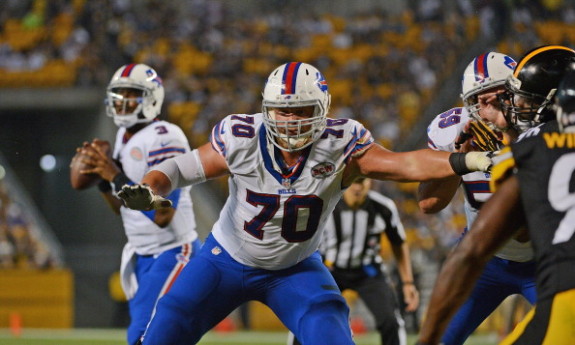 Center Eric Wood #70 of the Buffalo Bills blocks as quarterback EJ Manuel #3 looks to pass