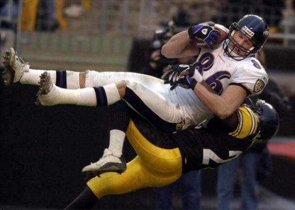 Baltimore Ravens' tight end Todd Heap (top) catche